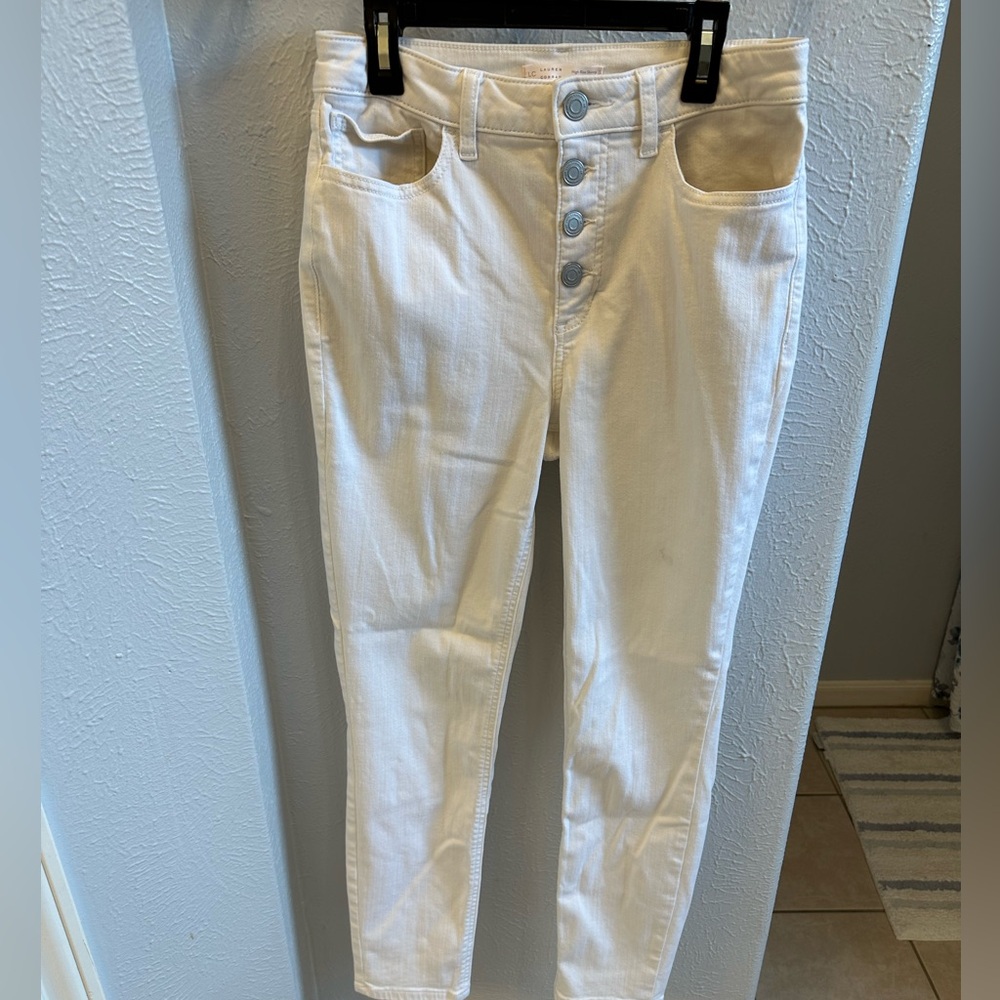High waisted white button front skinny jeans